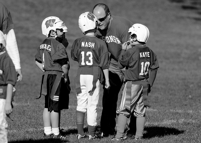 Coach (dad) pumps up the team credits Jim Larrison (CC BY 2.0)